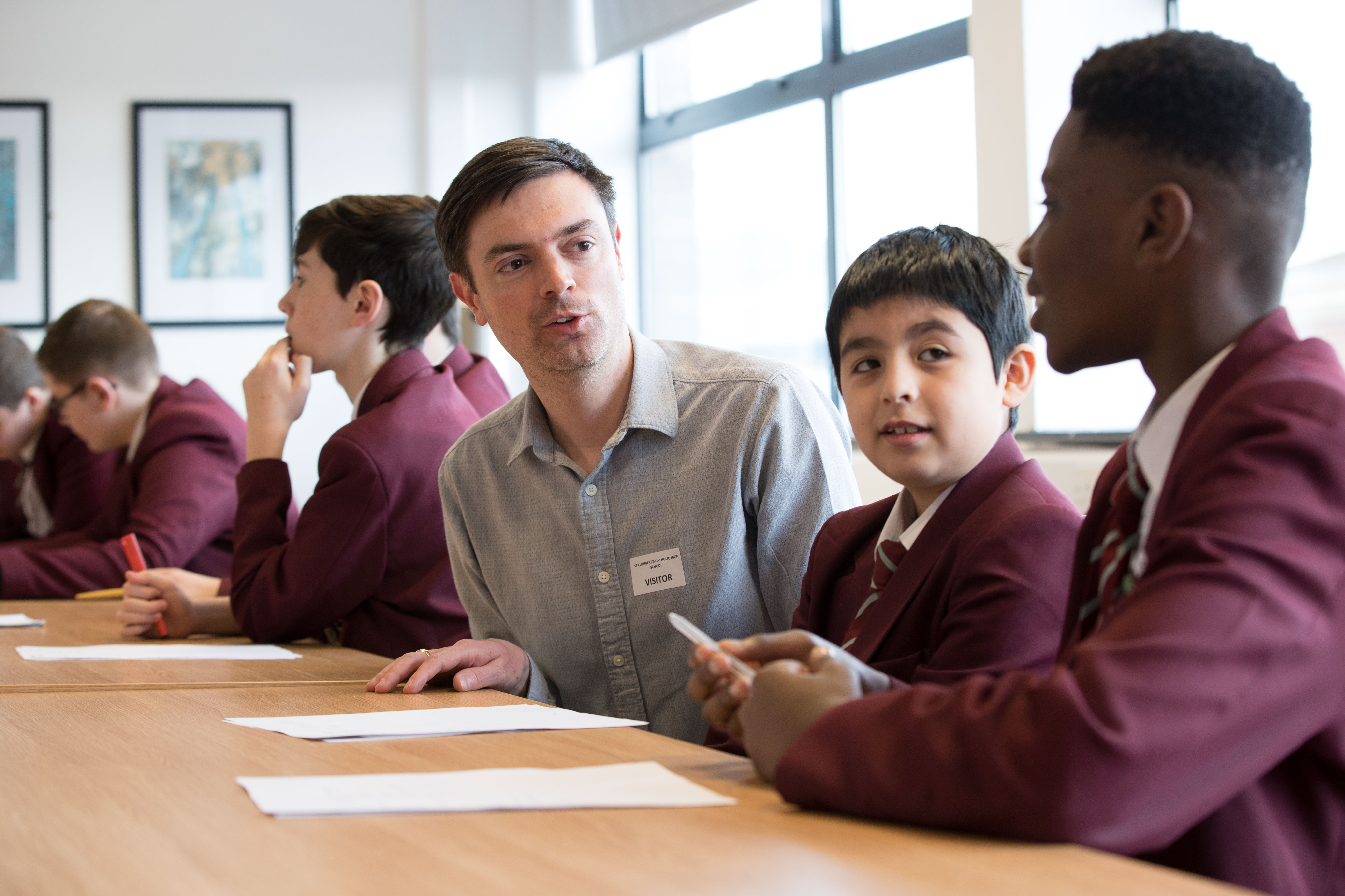 Jake Morris-Campbell with St Cuthbert's students